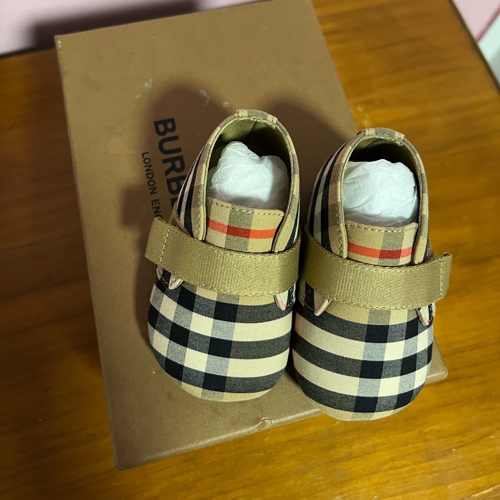 Like new , worn once new born baby soft bottom Burberry shoes.